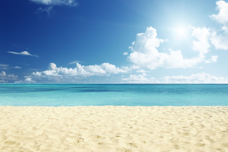 White sand with calm blue water